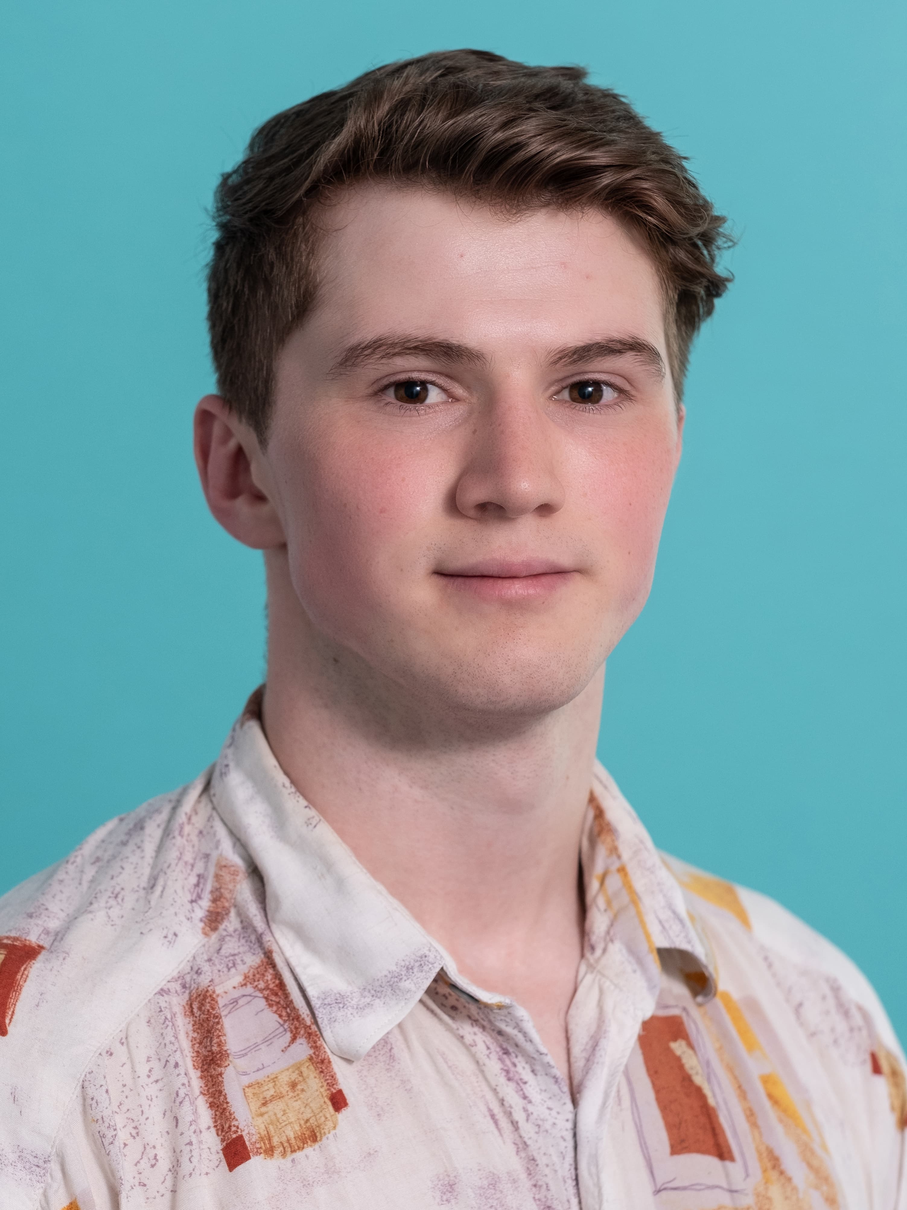 headshot of male in floral shirt